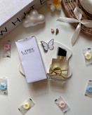 ادکلن Libre YSL: رایحه آزاد و جسورانه زنانه با عطر شکوفه پرتقال.