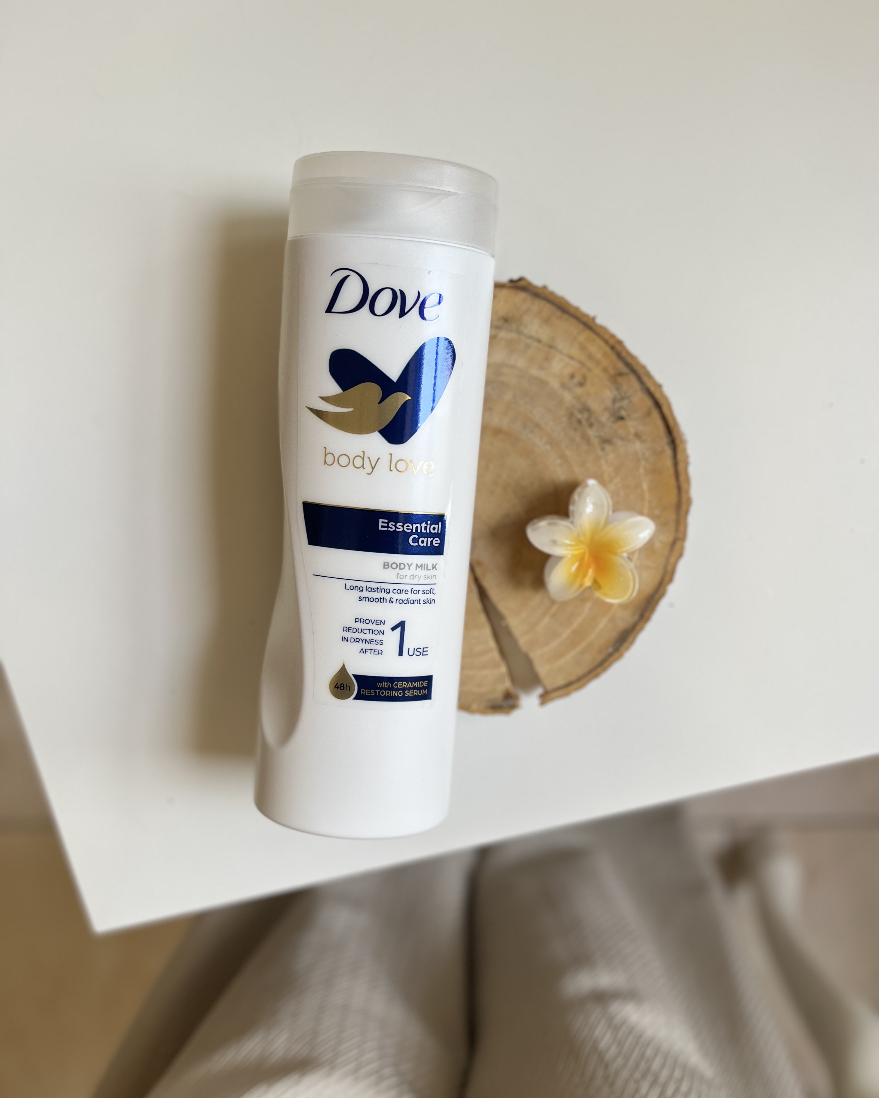 خرید ارزان قیمت لوسیون ابرسان بدن داو dove رایحه شیر خوشبو نرم کننده