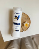 خرید ارزان قیمت لوسیون ابرسان بدن داو dove رایحه شیر خوشبو نرم کننده